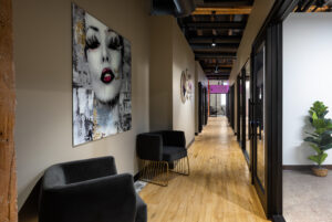 waiting room and hallway with comfortable chairs and artwork.